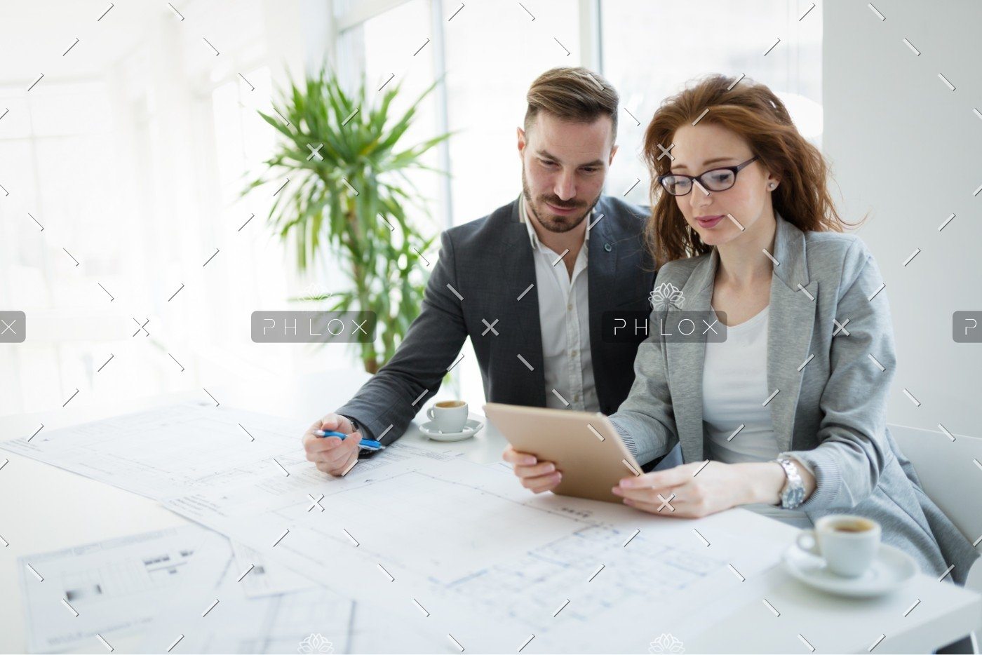 demo-attachment-337-portrait-of-young-architect-woman-on-meeting-KFZCE3A